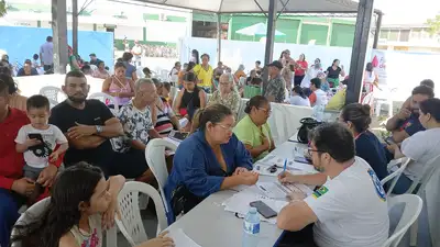 notícia: Com apoio do Governo do Amapá, moradores do Muca recebem ação de saúde, cidadania e bem-estar em Macapá